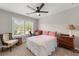 Cozy bedroom with natural light, ceiling fan, and classic furnishings at 1612 Silver Oak Dr, Austell, GA 30106