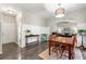 View of dining area, open floor plan, with archway to living room and wainscotting at 1612 Silver Oak Dr, Austell, GA 30106