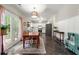 Bright dining area and kitchen boast white cabinets, stainless steel appliances, and tile floors at 1612 Silver Oak Dr, Austell, GA 30106