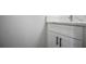 Bathroom features a white vanity with a marble countertop and black modern handles at 2682 Field Spring Dr, Lithonia, GA 30058