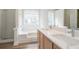 Bathroom boasts double sinks, sleek countertops, a bathtub, and a separate shower area at 2682 Field Spring Dr, Lithonia, GA 30058