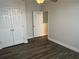 Inviting bedroom featuring modern flooring and closet, complemented by neutral tones and ambient lighting at 2682 Field Spring Dr, Lithonia, GA 30058