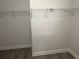 Walk-in closet provides ample storage space with wire shelving and neutral wall and floor at 2682 Field Spring Dr, Lithonia, GA 30058