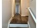 Hallway view features updated flooring and neutral paint, creating a welcoming and bright atmosphere at 2682 Field Spring Dr, Lithonia, GA 30058