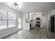 Modern kitchen features stainless appliances, white cabinets, and ample countertop space at 2682 Field Spring Dr, Lithonia, GA 30058