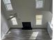 Bright living room with vaulted ceilings, fireplace, and abundant natural light at 2682 Field Spring Dr, Lithonia, GA 30058