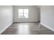 Bright living room with new grey floors and fresh neutral paint at 2682 Field Spring Dr, Lithonia, GA 30058