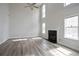 Spacious living room with soaring ceilings, fireplace, and abundant natural light at 2682 Field Spring Dr, Lithonia, GA 30058