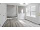 Living room with open layout, new floors, and lots of natural light at 2682 Field Spring Dr, Lithonia, GA 30058