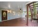 Covered back deck with stairs to yard has lighting and ceiling fan at 3525 Stone Cliff Way, Woodstock, GA 30189