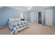 Light blue bedroom with lots of natural light, plush carpet, and ceiling fan at 3525 Stone Cliff Way, Woodstock, GA 30189