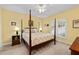 Comfortable bedroom with a four poster bed, neutral colors, and ample natural light at 3525 Stone Cliff Way, Woodstock, GA 30189