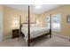Bedroom featuring a four poster bed, neutral colored walls, and carpeted flooring at 3525 Stone Cliff Way, Woodstock, GA 30189
