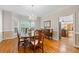Elegant dining room with chandelier and view into the kitchen at 3525 Stone Cliff Way, Woodstock, GA 30189