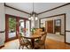 Bright dining room with hardwood floors and access to an outdoor deck at 3525 Stone Cliff Way, Woodstock, GA 30189