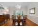 Bright dining area with a large window, wood floors, and stylish decor perfect for entertaining at 3525 Stone Cliff Way, Woodstock, GA 30189