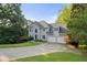 Charming two-story home with manicured lawn and a long driveway at 3525 Stone Cliff Way, Woodstock, GA 30189