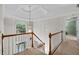 Light-filled foyer with an elegant chandelier and staircase at 3525 Stone Cliff Way, Woodstock, GA 30189