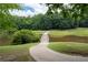 Serene golf course view with a charming bridge over a tranquil water hazard at 3525 Stone Cliff Way, Woodstock, GA 30189