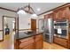 Gourmet kitchen with cherry cabinets, stainless steel appliances, granite countertops, and center island at 3525 Stone Cliff Way, Woodstock, GA 30189