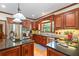 Gourmet kitchen with stainless steel appliances, granite countertops, and custom cabinets at 3525 Stone Cliff Way, Woodstock, GA 30189