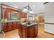 Modern kitchen with dark wood cabinets, granite countertops, stainless steel appliances, and island at 3525 Stone Cliff Way, Woodstock, GA 30189