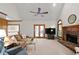 Inviting living room featuring a vaulted ceiling, fireplace, and French doors to the outdoor space at 3525 Stone Cliff Way, Woodstock, GA 30189