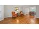 Cozy living room featuring hardwood floors, two chairs, and view into the dining room at 3525 Stone Cliff Way, Woodstock, GA 30189