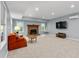 Spacious living room with neutral walls, carpet flooring, and cozy fireplace, perfect for gatherings at 3525 Stone Cliff Way, Woodstock, GA 30189