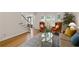 Bright living room with two orange chairs, bay windows, and hardwood floors at 3525 Stone Cliff Way, Woodstock, GA 30189