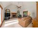 Cozy living room with stone fireplace, vaulted ceiling, and natural light at 3525 Stone Cliff Way, Woodstock, GA 30189