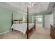 This light and airy main bedroom features a ceiling fan, and an attached sitting room at 3525 Stone Cliff Way, Woodstock, GA 30189