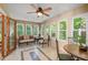 Inviting sunroom filled with natural light, ideal for relaxation and entertaining at 3525 Stone Cliff Way, Woodstock, GA 30189
