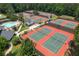 Aerial view of community tennis courts with adjacent pool and seating areas at 3525 Stone Cliff Way, Woodstock, GA 30189