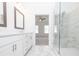Bathroom with double sinks, vanity and modern glass shower at 4231 Millcroft Pl # 207, Buford, GA 30518
