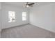 Bright bedroom with carpeting, large windows, and neutral walls providing lots of natural light at 4231 Millcroft Pl # 207, Buford, GA 30518