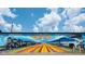 Vibrant mural art with trains in #Suwanee in front of blue skies and a modern train at 4231 Millcroft Pl # 207, Buford, GA 30518