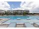 Community swimming pool featuring lounge chairs, a shallow end, and a deep swimming section at 4231 Millcroft Pl # 207, Buford, GA 30518