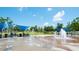 Community water park for Gathering fun in the sun features benches and shaded pavilions at 4231 Millcroft Pl # 207, Buford, GA 30518