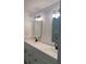 Bathroom featuring a double sink vanity with modern fixtures and mirrors at 6716 Browns Mill Rd, Lithonia, GA 30038