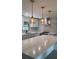 Modern kitchen featuring gray cabinets, quartz countertops, and stainless steel appliances at 6716 Browns Mill Rd, Lithonia, GA 30038