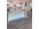 Modern kitchen featuring an island, white cabinets and pendant lights at 6716 Browns Mill Rd, Lithonia, GA 30038