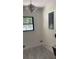 Laundry room with chandelier, grey concrete floors, and a view to the back yard and pool at 6716 Browns Mill Rd, Lithonia, GA 30038