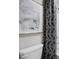 Contemporary bathroom with a modern toilet, decorative shower curtain, and stylish accents at 1240 Arnhem Dr, Hampton, GA 30228