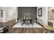 Dining room with dark accent wall, modern furnishings, and stylish decor at 1240 Arnhem Dr, Hampton, GA 30228