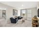 Inviting living room with comfortable seating, carpet, and decorative accents at 1240 Arnhem Dr, Hampton, GA 30228