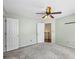 Bedroom with neutral paint and carpet flooring, with view into closet at 2196 Kildare Nw Way, Kennesaw, GA 30152