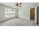 Bright bedroom featuring neutral paint, carpet flooring, and double windows at 2196 Kildare Nw Way, Kennesaw, GA 30152