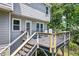 Elevated deck featuring a black metal railing with outdoor seating and stair access at 2196 Kildare Nw Way, Kennesaw, GA 30152