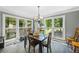 Sun-filled dining area with large windows providing beautiful backyard views at 2196 Kildare Nw Way, Kennesaw, GA 30152